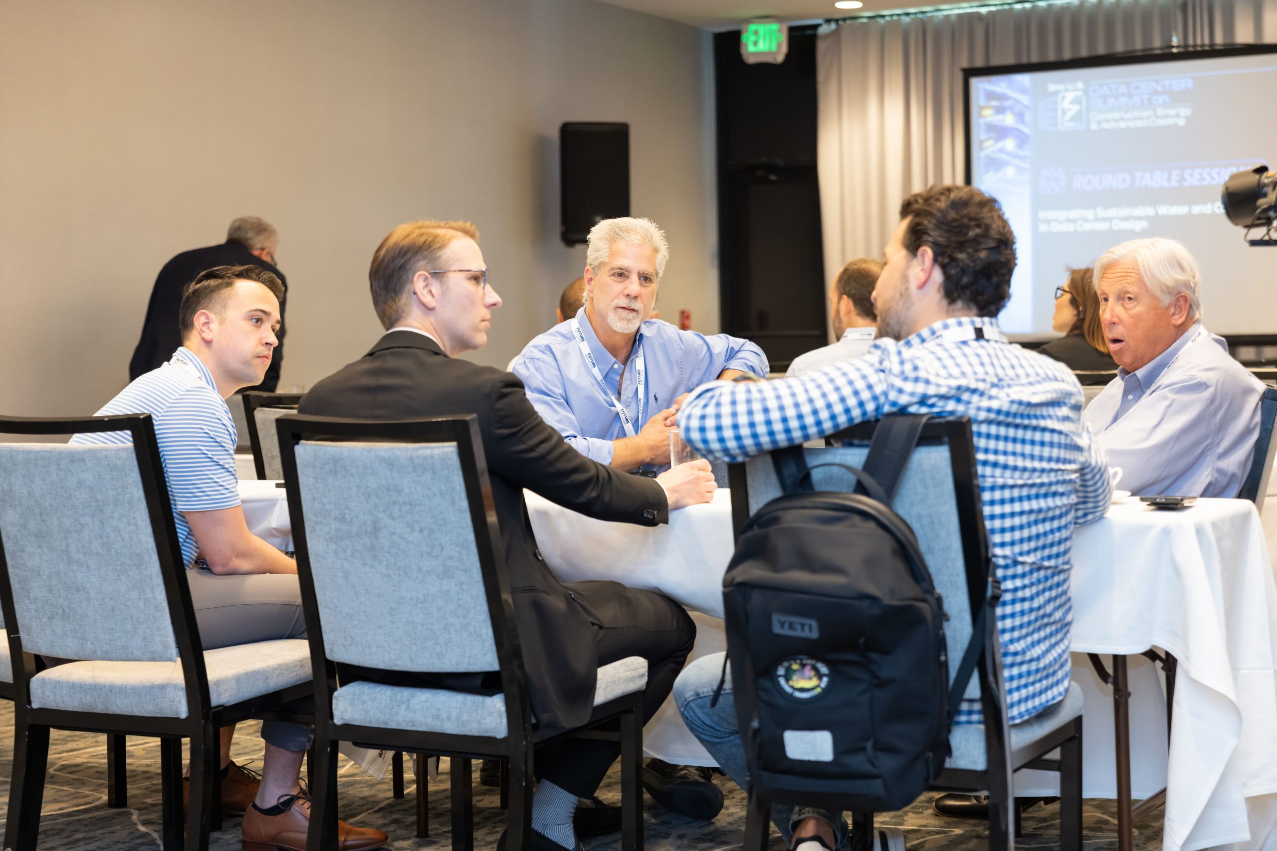 Executive discussion panel at a past summit