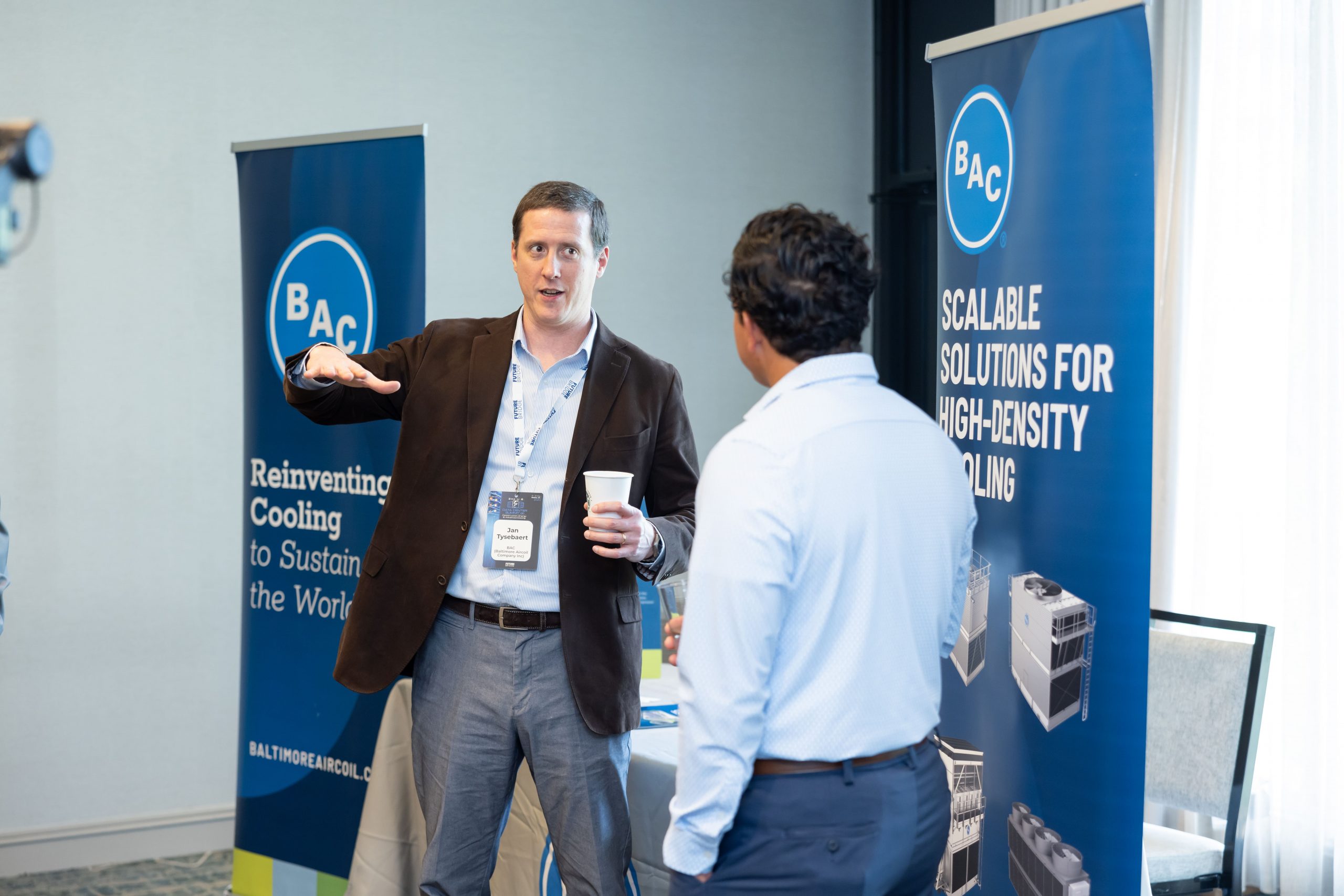 Exhibitors speaking with delegates